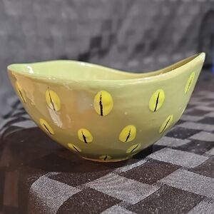 Handmade Ceramic Bowl/Cup with a Light Green Glaze and Yellowish "Cat-Eyes"